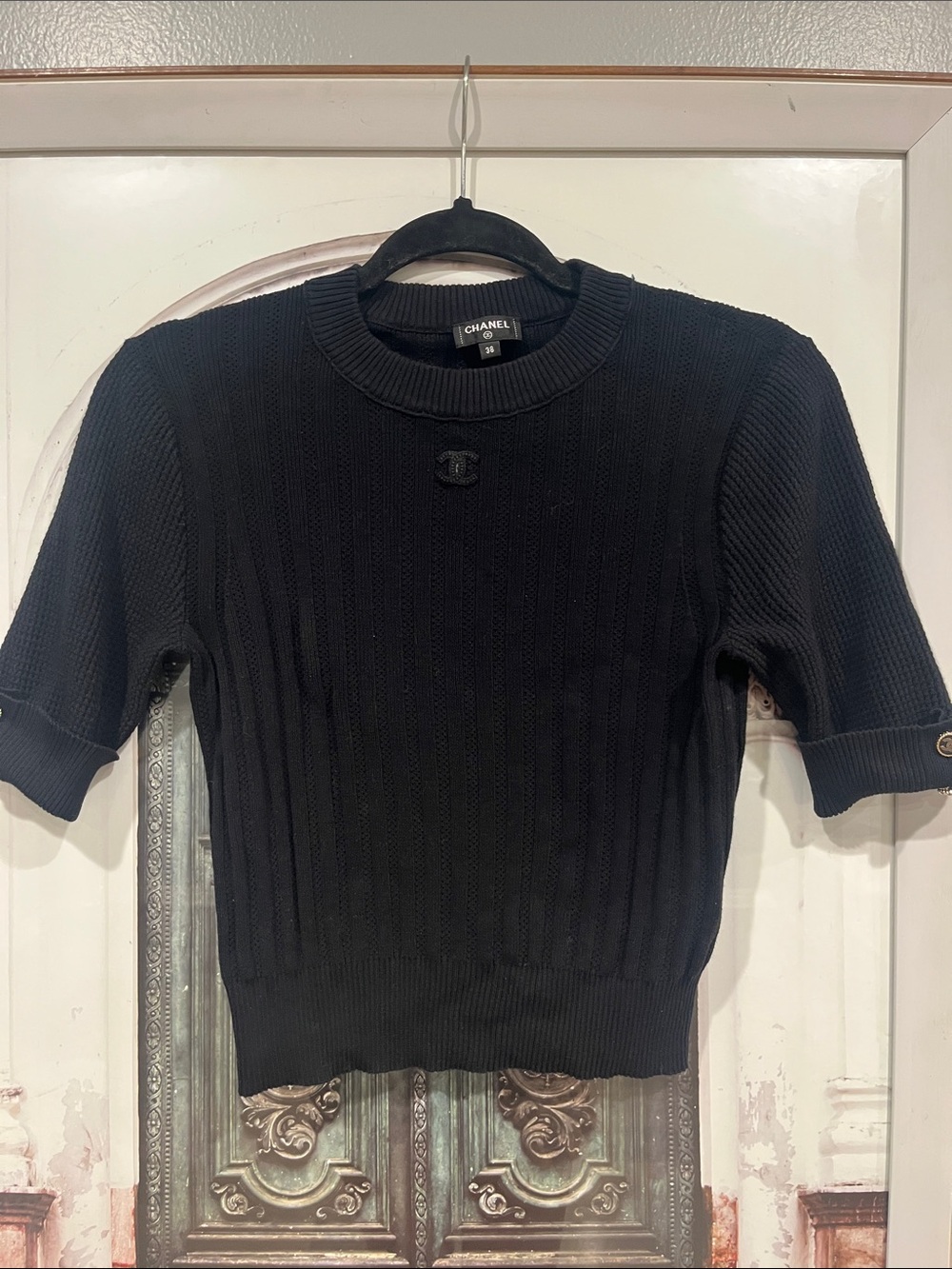 CHANEL Black Ribbed Short Sleeve Knit Top with Logo Button